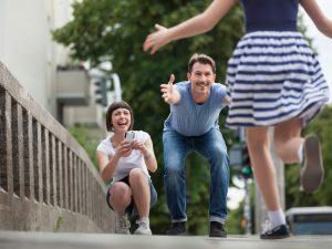 Parents joyfully welcoming a child, symbolising family reunification possible through parent visa Australia immigration process.